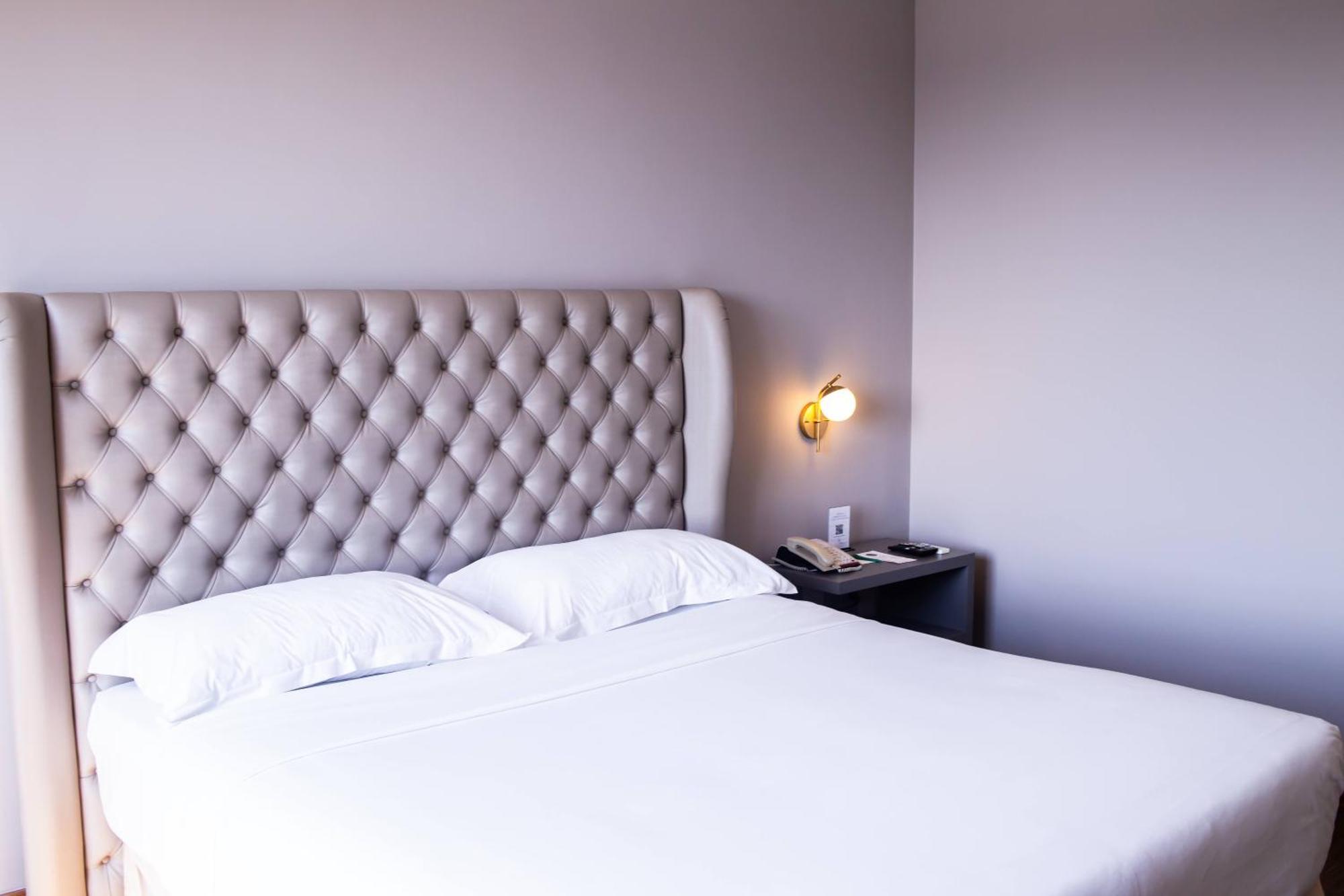 Ouro Minas Hotel Belo Horizonte, Dolce By Wyndham Zewnętrze zdjęcie A bedroom at the hotel